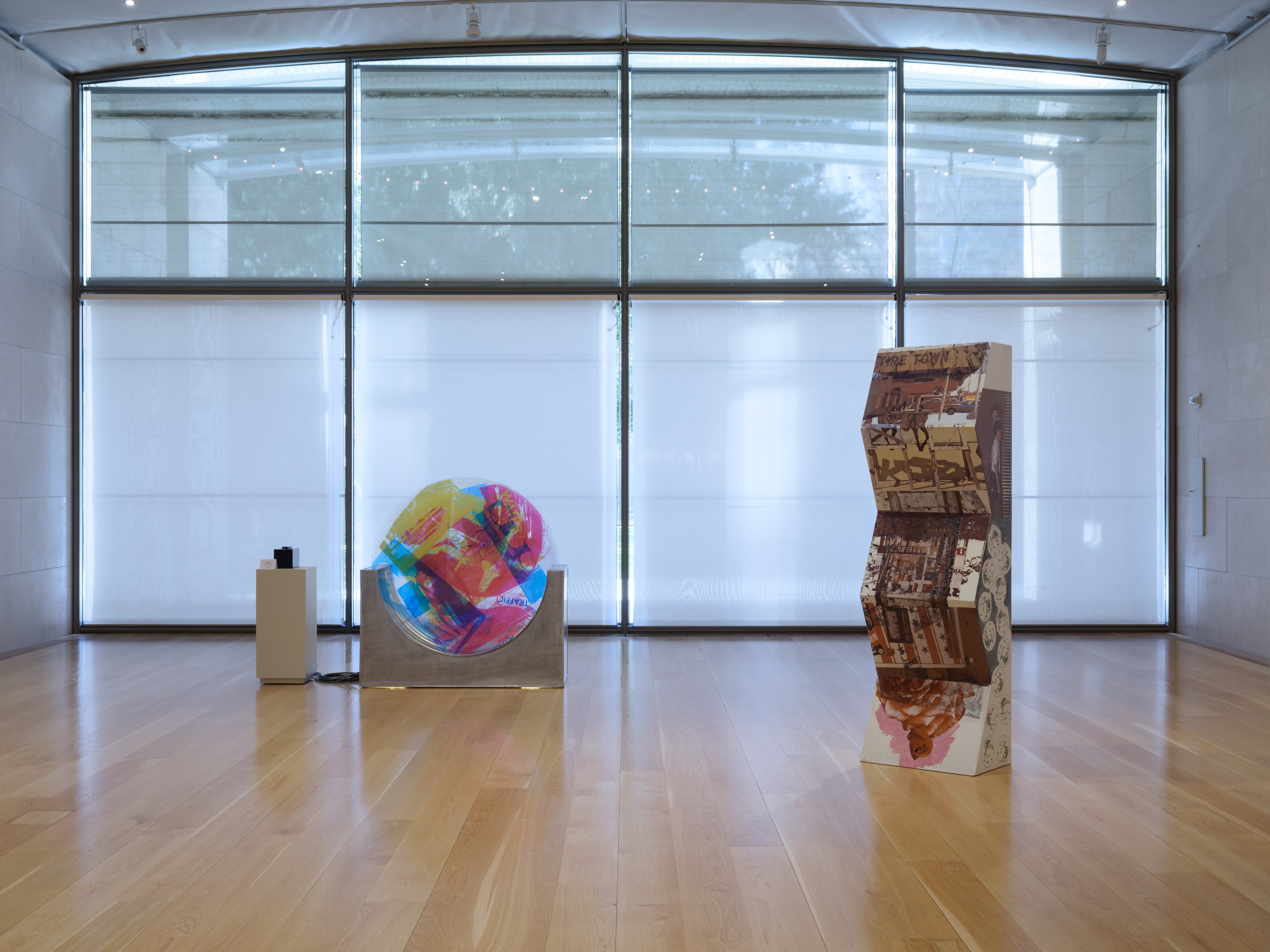 Two sculptures side by side in a gallery space
